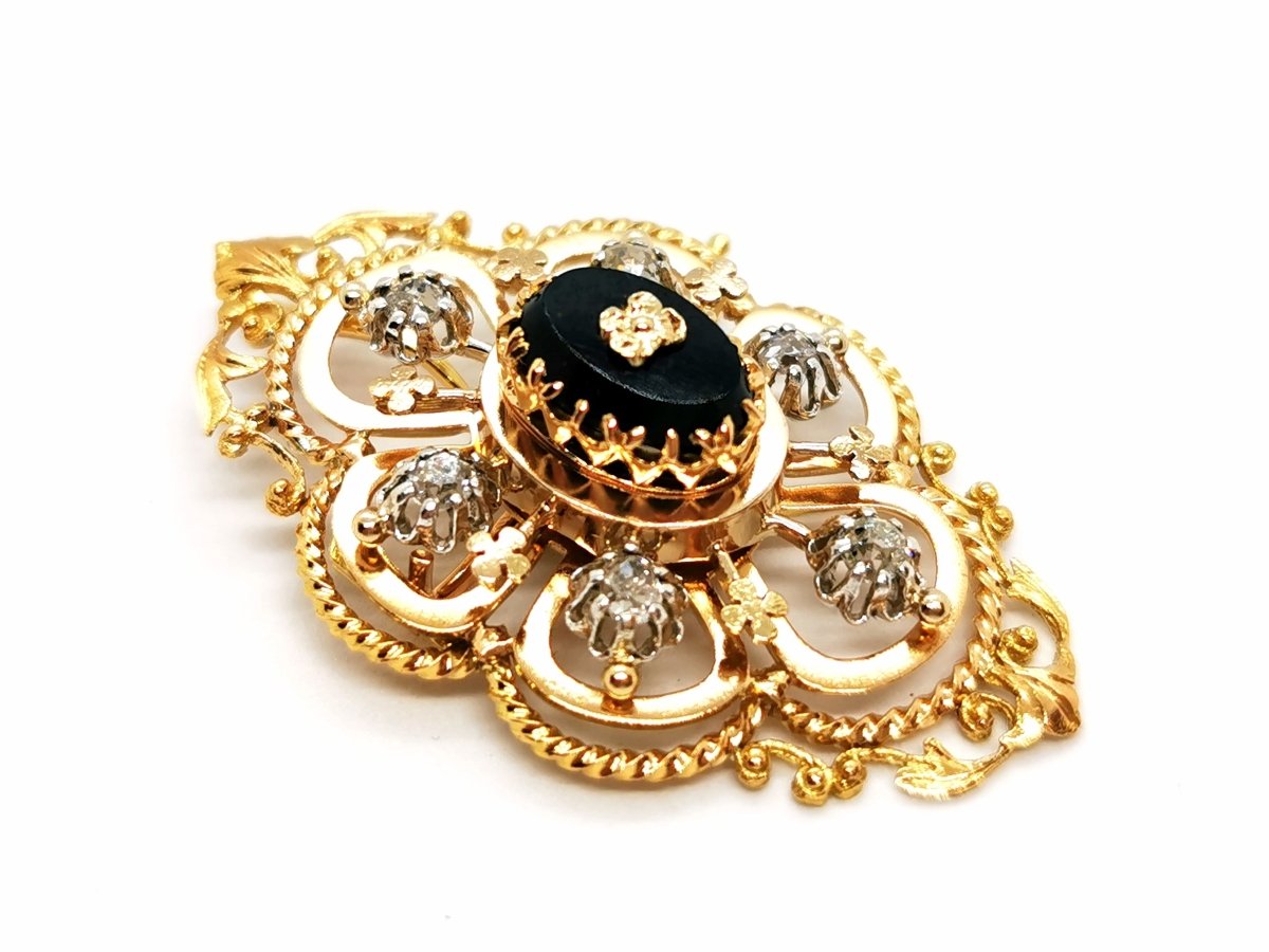 Broche Art déco en or jaune, platine, diamants et onyx - Castafiore