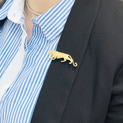 Broche Cartier, "Samantha", or jaune, émeraude et onyx. - Castafiore