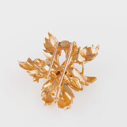 Broche CHAUMET "Feuillage" en or jaune, diamants et émeraudes - Castafiore