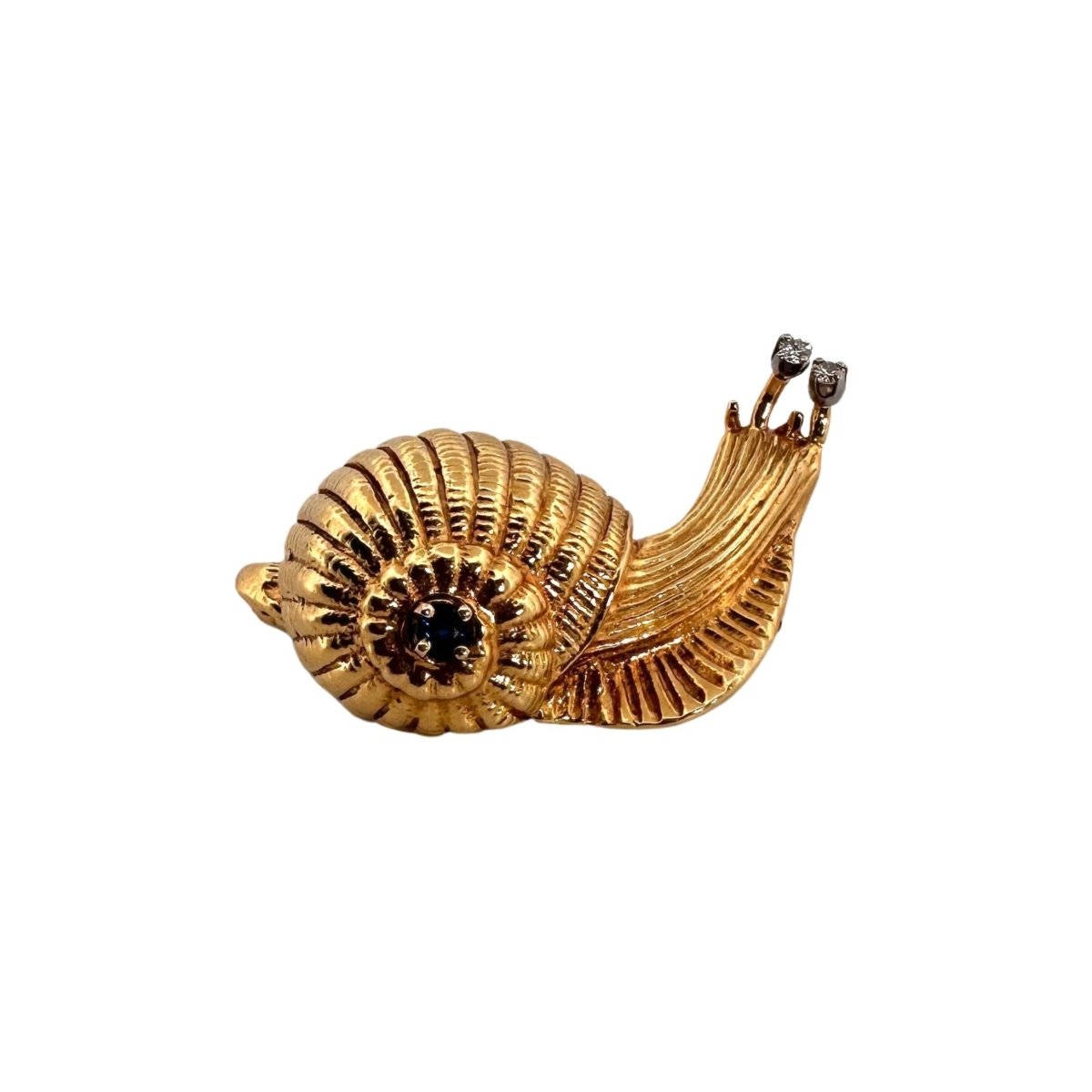 Broche Clip CARTIER "Escargot" en or jaune, saphir et diamant - Castafiore