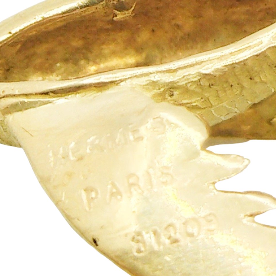 Broche Clip HERMÈS "Envol de perdreaux" en or jaune et émeraudes - Castafiore