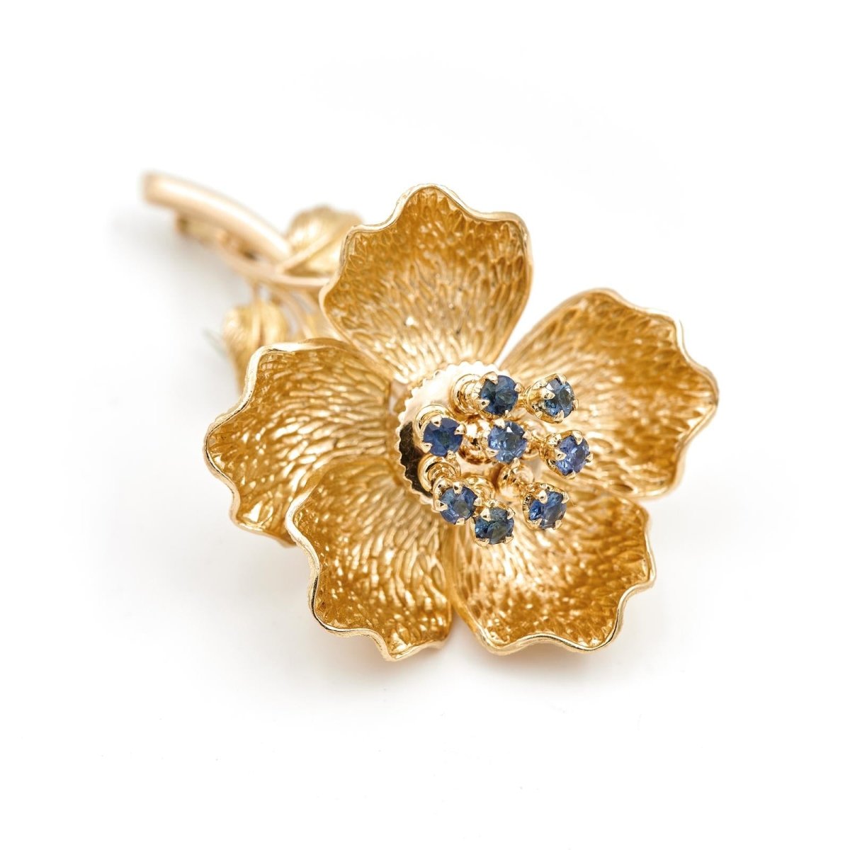 Broche fleur articulée en or jaune et saphirs - Castafiore