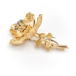 Broche fleur articulée en or jaune et saphirs - Castafiore
