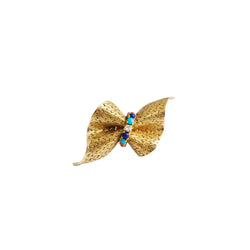Broche HERMÈS "Noeud" en or jaune, lapis lazuli, turquoises, corail et diamant - Castafiore
