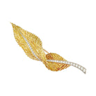 Broche HERMÈS "Plume" en or jaune, platine et diamants - Castafiore