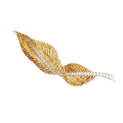 Broche HERMÈS "Plume" en or jaune, platine et diamants - Castafiore