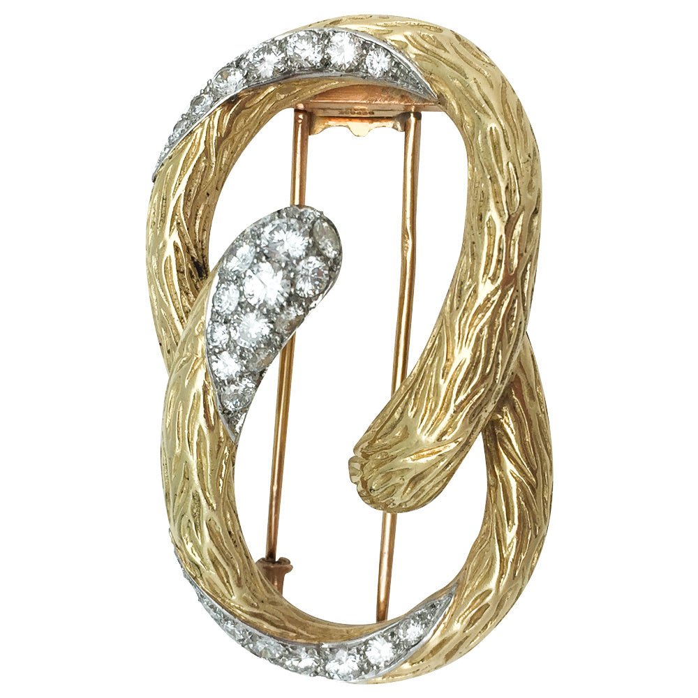 Broche MAUBOUSSIN "Boucle" en or jaune et platine, diamants - Castafiore