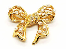 Broche noeud en or jaune, diamants et perles - Castafiore