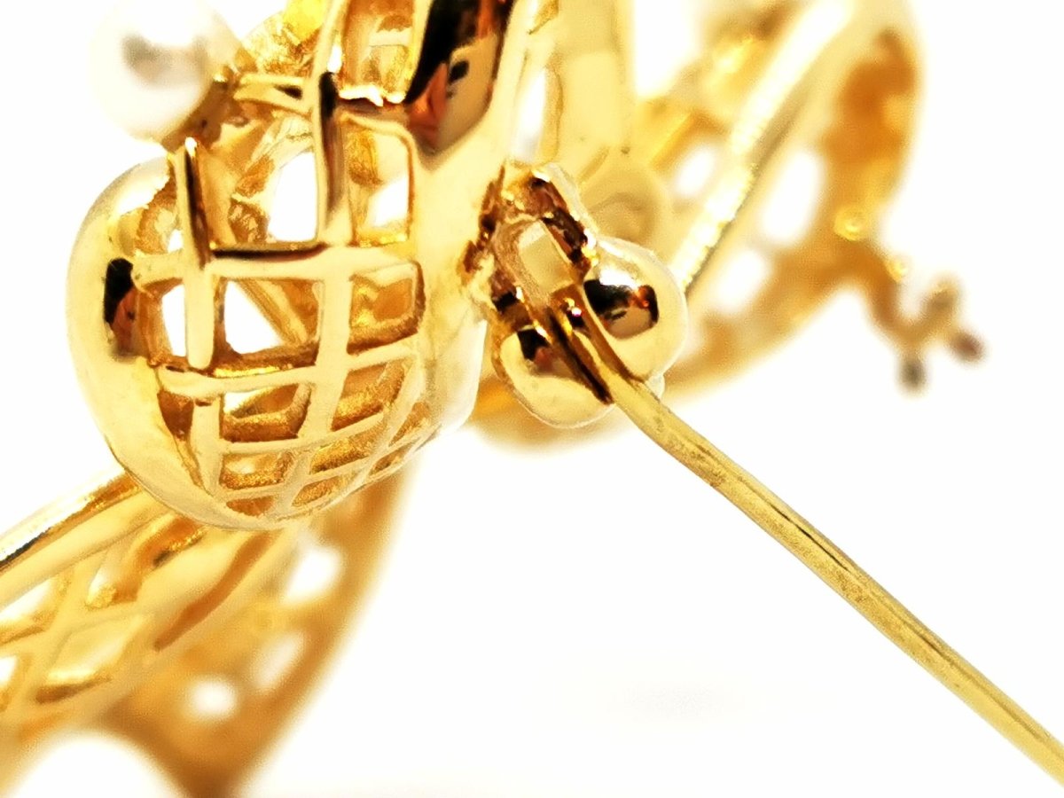Broche noeud en or jaune, diamants et perles - Castafiore