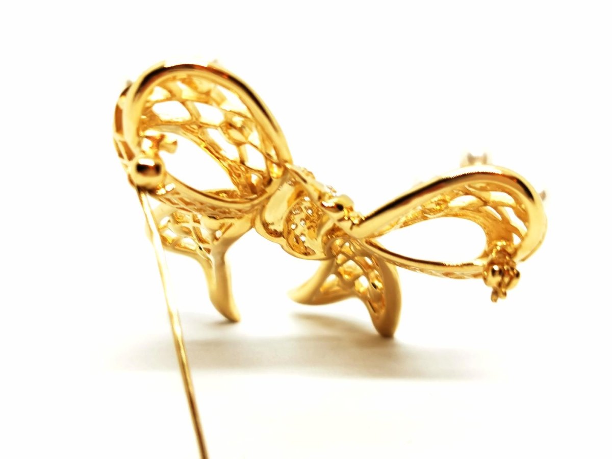 Broche noeud en or jaune, diamants et perles - Castafiore