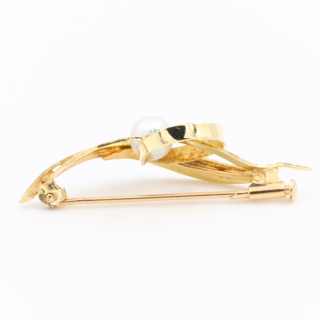 Broche or jaune et perle - Castafiore