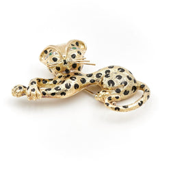 Broche panthère FRED, en or jaune, émeraudes et diamants - Castafiore