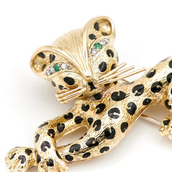 Broche panthère FRED, en or jaune, émeraudes et diamants - Castafiore