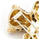 Broche panthère FRED, en or jaune, émeraudes et diamants - Castafiore