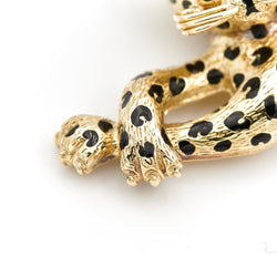 Broche panthère FRED, en or jaune, émeraudes et diamants - Castafiore