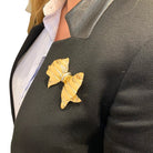 Broche REPOSSI "noeud" en ors jaune et blanc, diamants - Castafiore