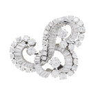 Clip J.Lacloche, "Volutes", platine, or blanc, diamants - Castafiore