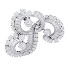 Clip J.Lacloche, "Volutes", platine, or blanc, diamants - Castafiore