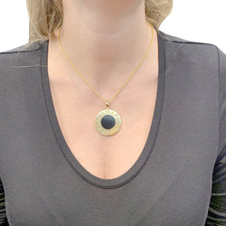 Collier BULGARI "Bulgari Bulgari" en or jaune, acier et onyx - Castafiore