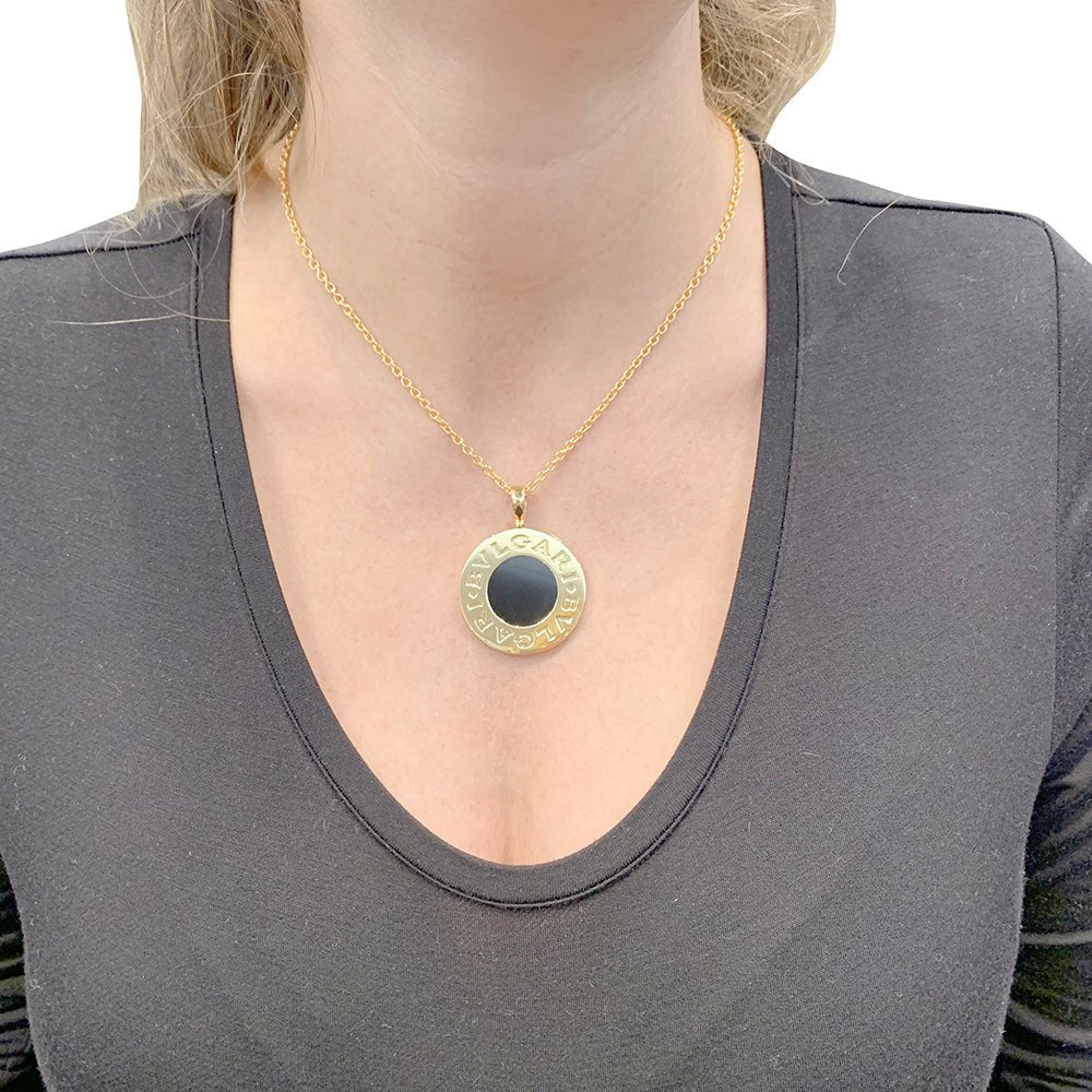 Collier BULGARI "Bulgari Bulgari" en or jaune, acier et onyx - Castafiore