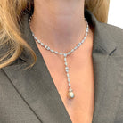 Collier cravate CARTIER, "Amour", or blanc, diamants, perle de Tahiti - Castafiore