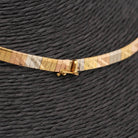 Collier d'occasion semi-rigide en or tricolore - Castafiore