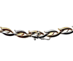 Collier et bracelet en or jaune et blanc 18 carats formant parure - Castafiore