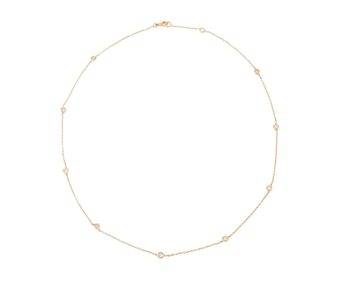 Collier or jaune intercalé de 9 diamants sur maille forçat en sertis clos. - Castafiore