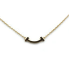 Collier TIFANNY & CO. "Smile T" en or jaune et diamants - Castafiore