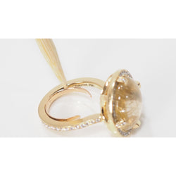 CHAUMET “Attrape Moi Galet” ring in yellow gold, rutilated quartz and diamonds