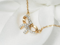 Collier avec motif nœud en or rose et diamants