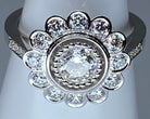 Bague marguerite en or 18 carats ornée de diamants de taille brillant