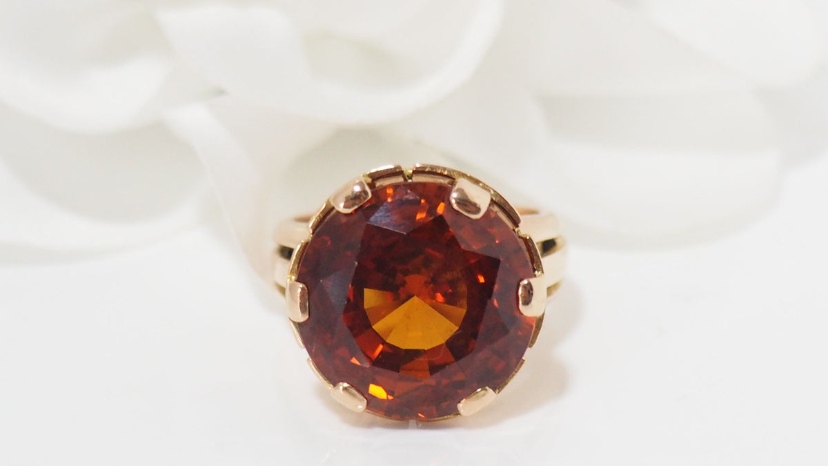 Bague vintage en or rose et saphir orange