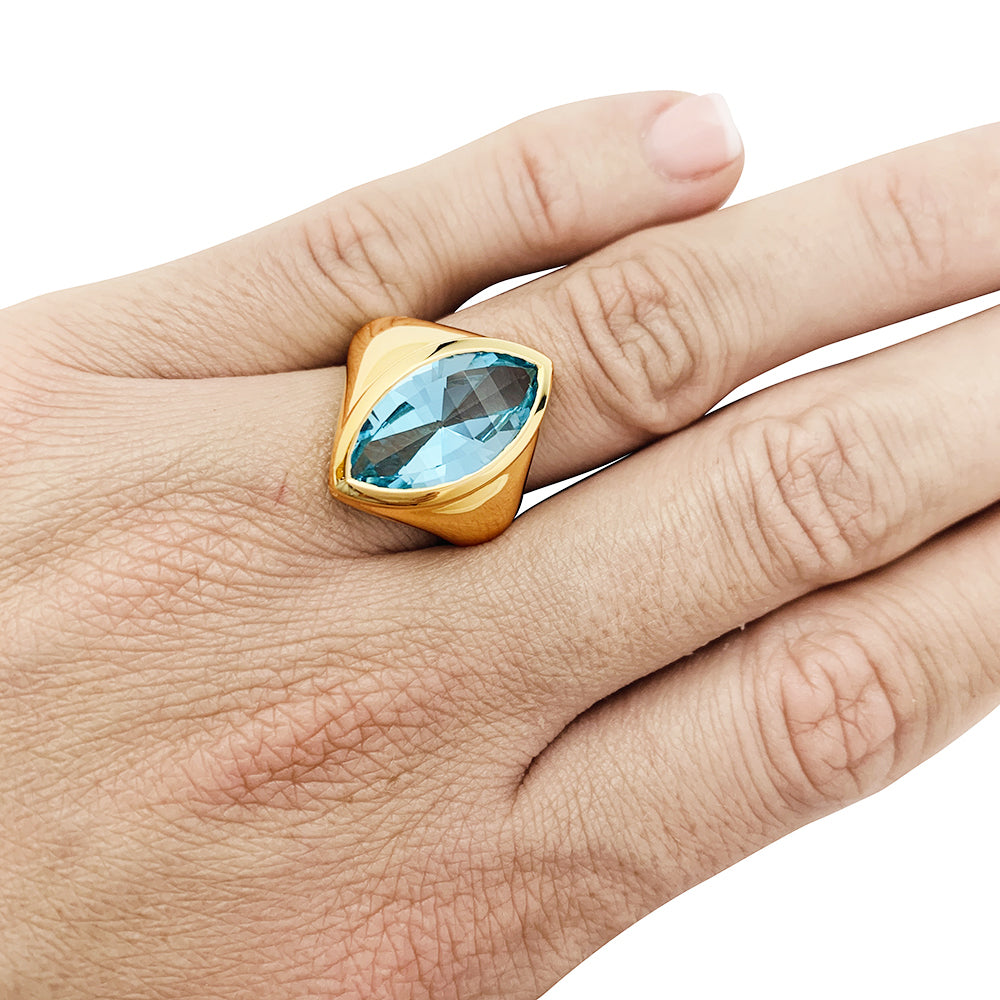 Bague or jaune et topaze bleue