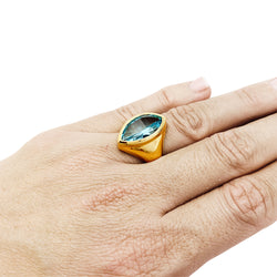 Bague or jaune et topaze bleue