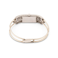 Montre de dame fine en or blanc, platine, brillants et onyx