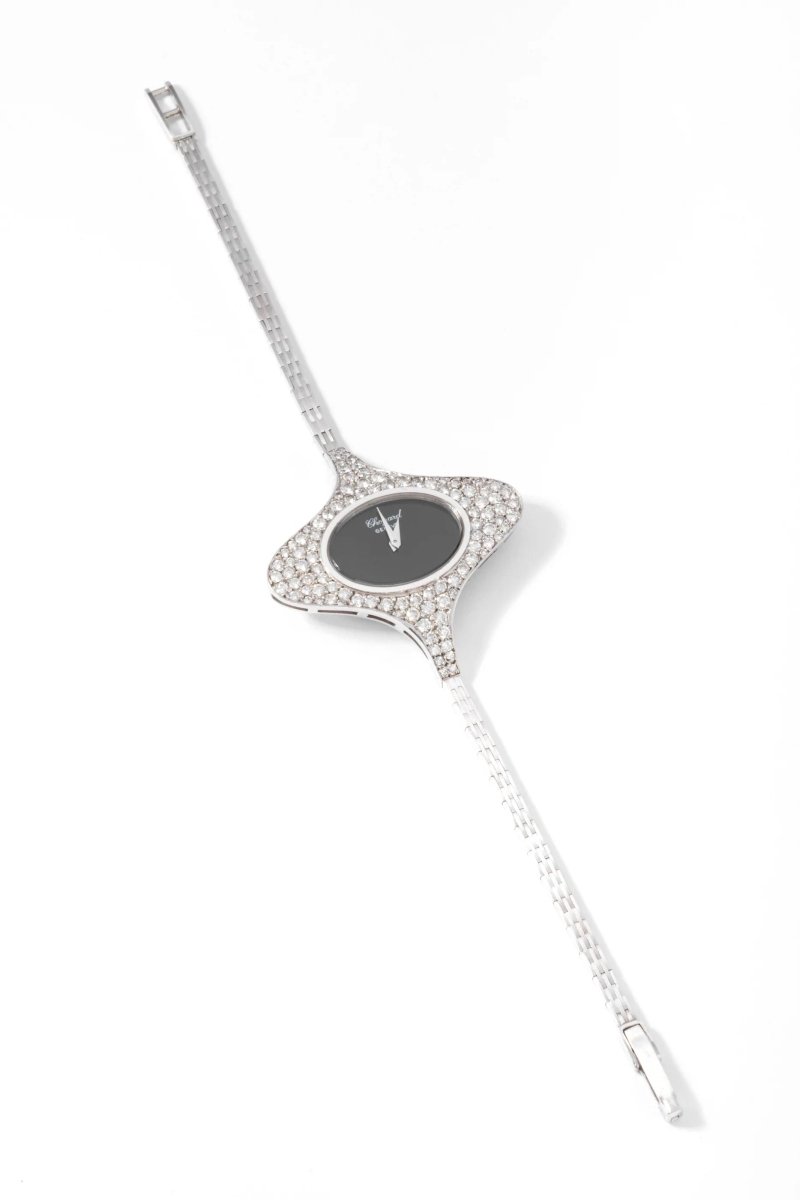 Montre ovale CHOPARD en or gris et diamants - Castafiore