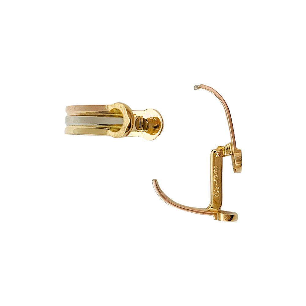 Paire de boutons de manchettes CARTIER "Mini Ressort CC" trois ors. - Castafiore