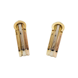 Paire de boutons de manchettes CARTIER "Mini Ressort CC" trois ors. - Castafiore