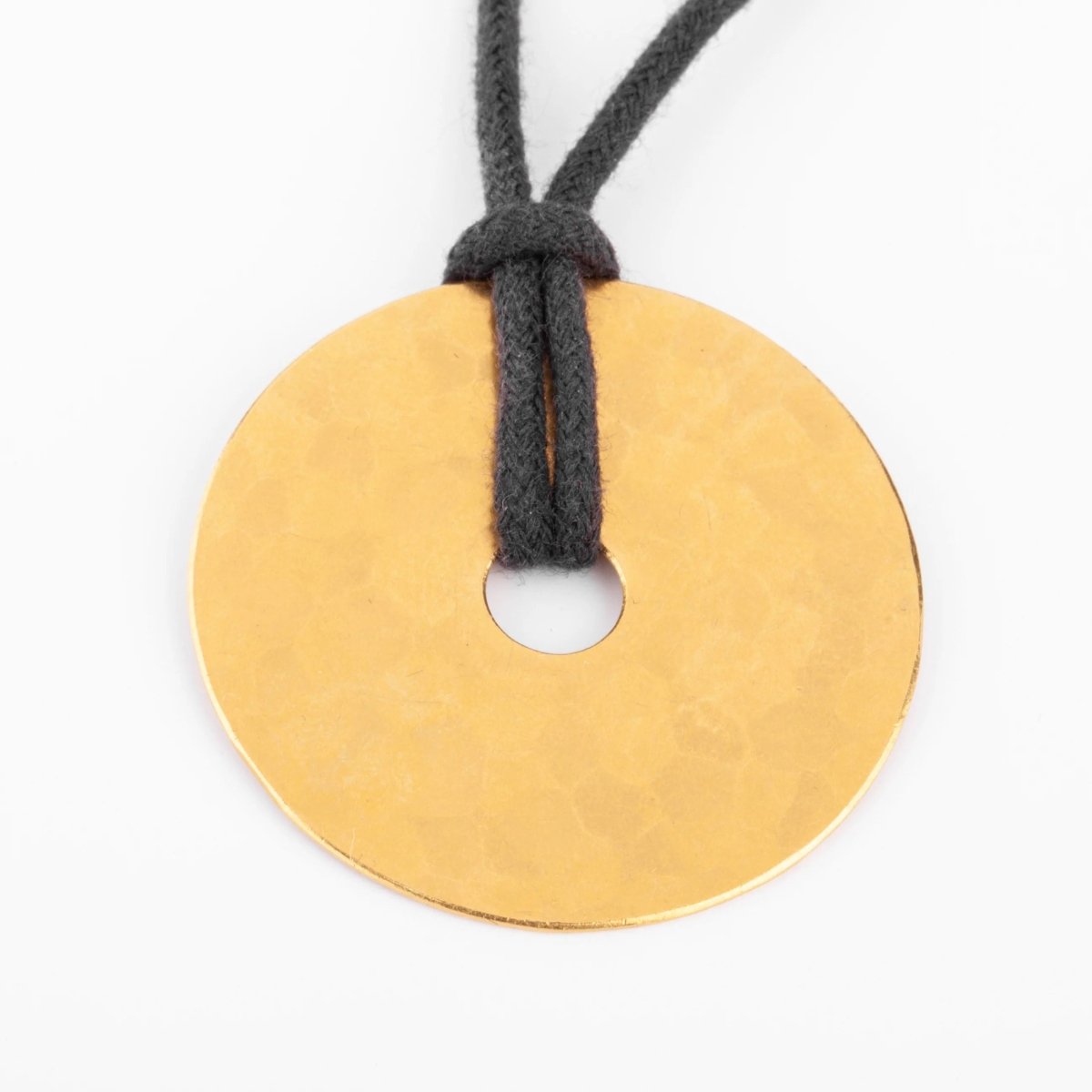 Pendentif martelée de la maison Dinh Van modèle cible - Castafiore