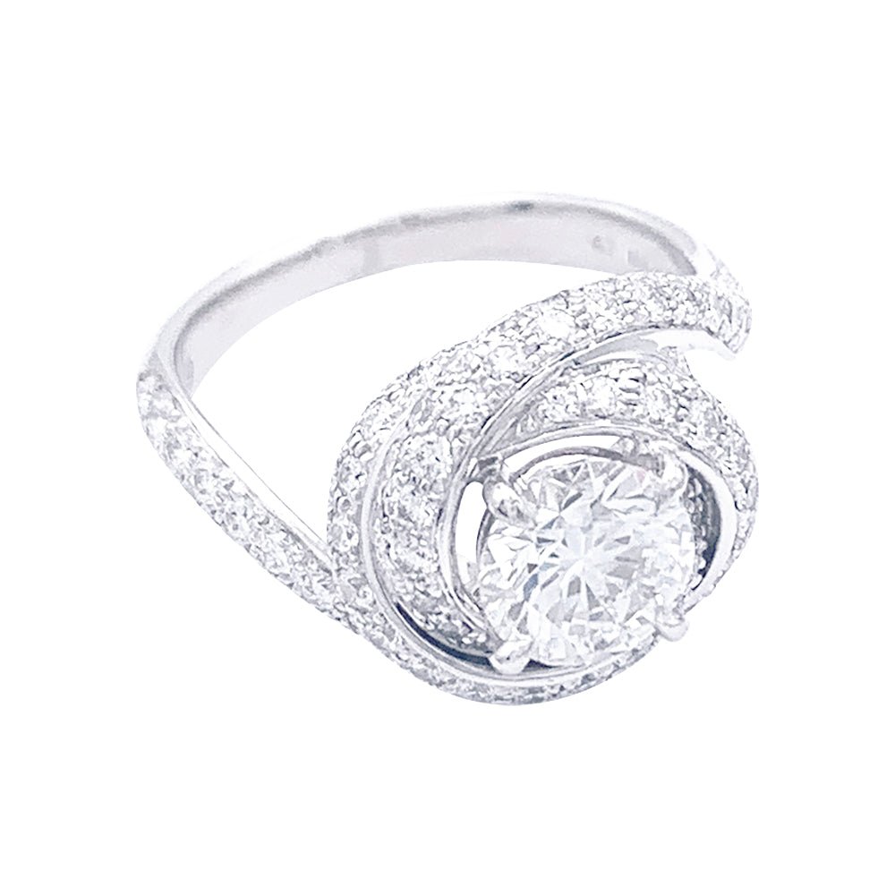 Solitaire Cartier, "Trinity Ruban", platine et diamants. - Castafiore