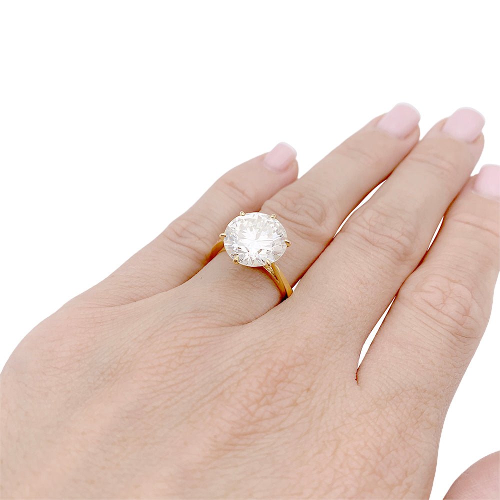 Solitaire en or jaune, diamant 5,77 cts. - Castafiore